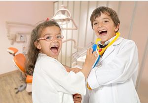 Kids playing dentist dress up