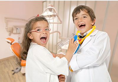 Kids playing dentist dress up